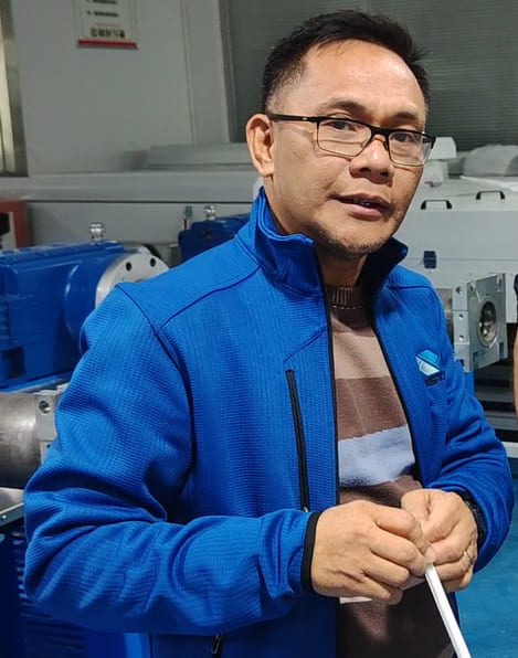 The customer's visiting engineer inspecting equipment at our factory in China.