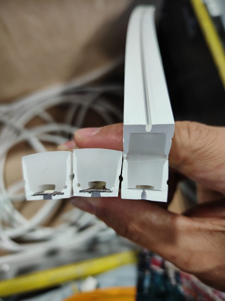 A partially cut, perfectly shaped LED strip cross-section compared alongside two previous, non-standard samples.