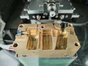 An LSR injection mold for LED strip end caps with configurations for straight, side-exit, and sealed-end outputs.