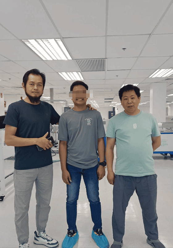 The customer's newly trained extrusion expert standing proudly among our engineering team.