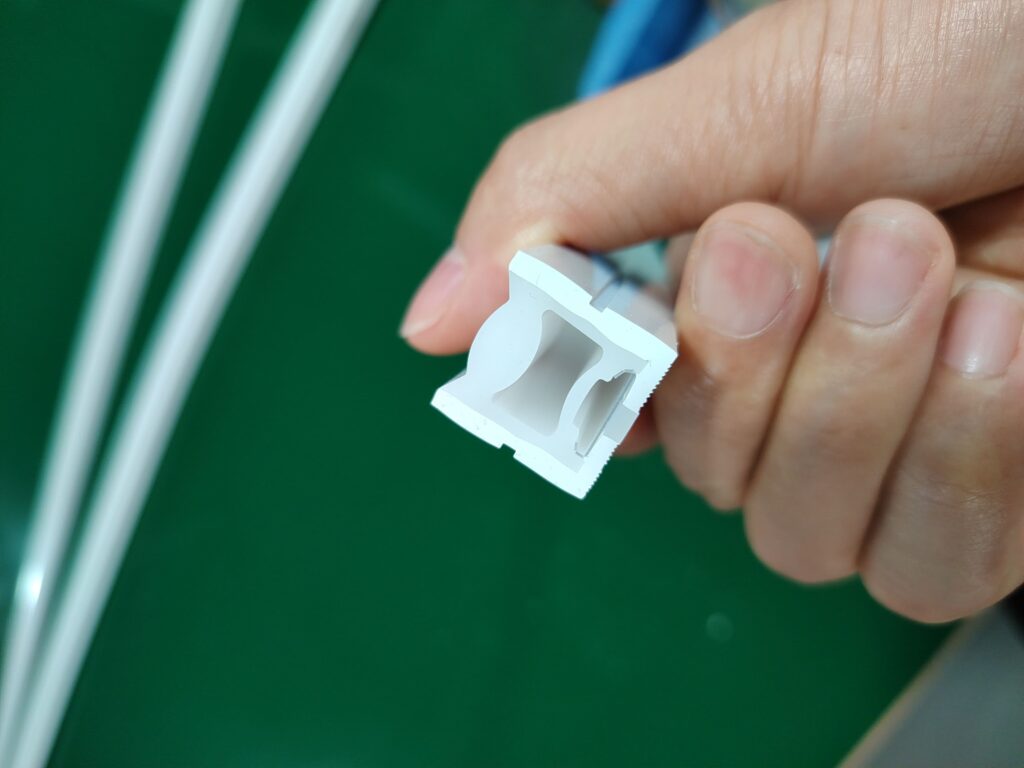 A flawless cross-section view of a silicone rubber tube profile used for LED strip encapsulation.