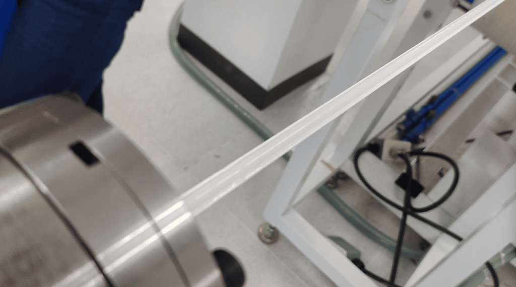 Defective silicone LED strip with pulse-like bumps extruding from the mold.