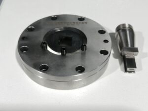 A complete set of meticulously cleaned and organized extrusion molds and components laid out for inspection.