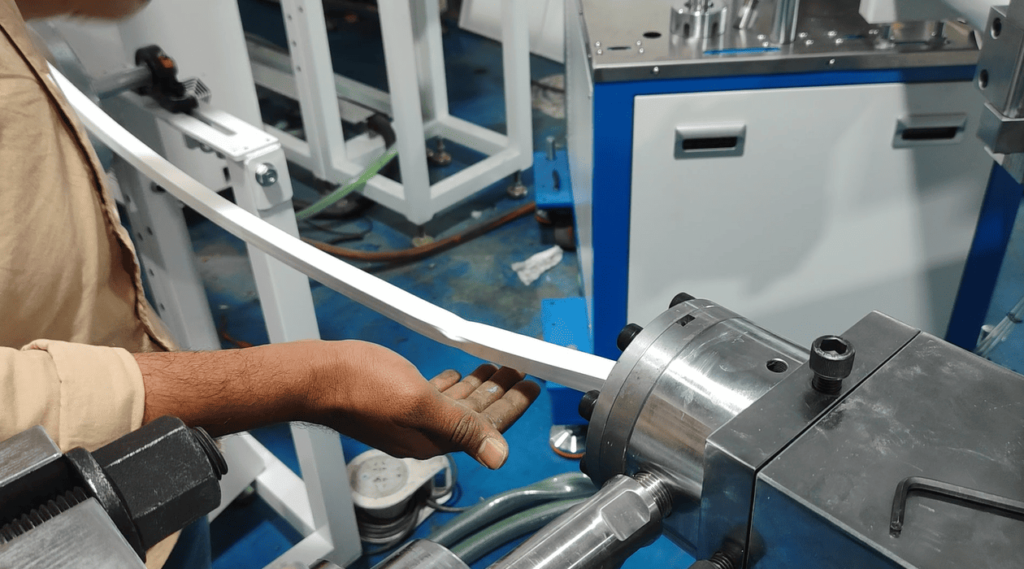 A misshapen silicone rubber strip caused by accidental hand contact ahead of the mold during extrusion.