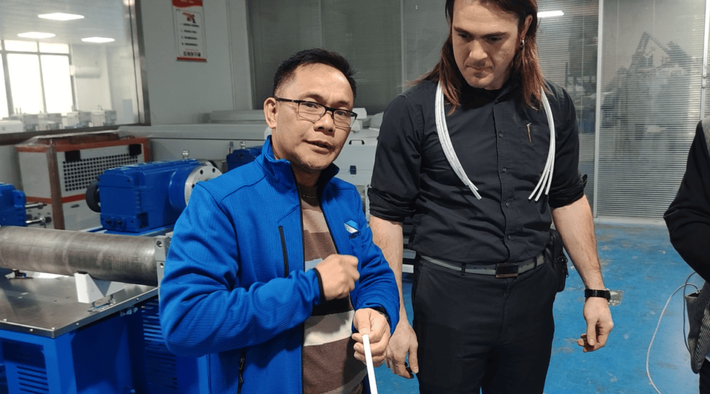 Satisfied customer giving positive feedback after successful qualification of the silicone extrusion machine.