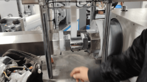 An automated feeding system loading silicone rubber pellets into the extrusion machine hopper.