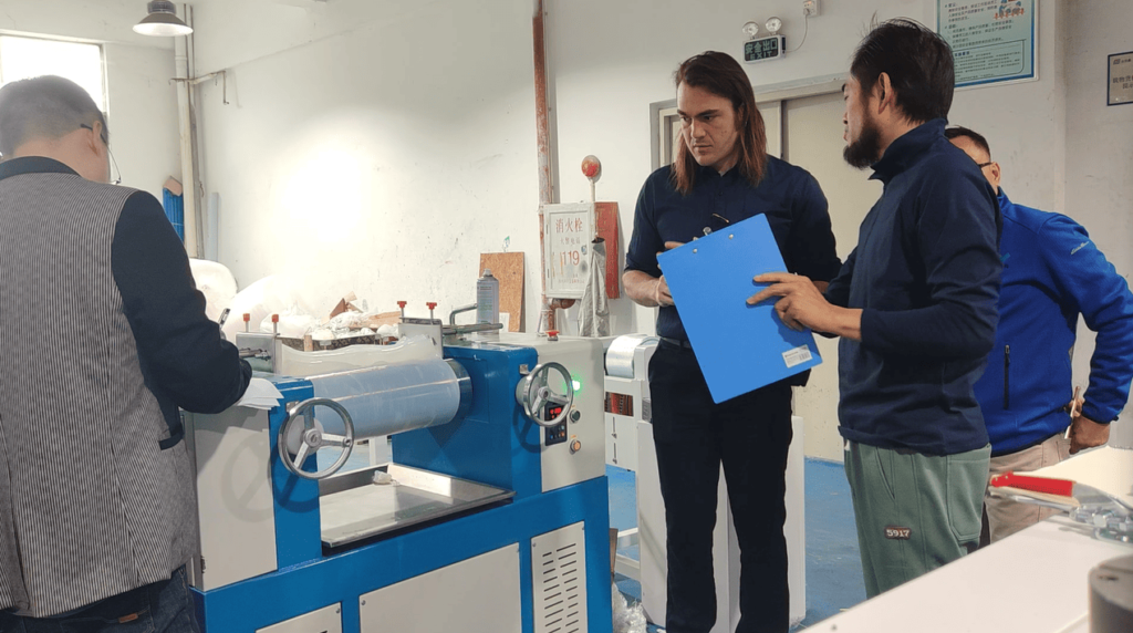 Customer's engineer holding a notebook and listening intently during technical training