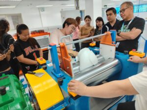 The customer's technical team observing the silicone rubber compounding and refining process.