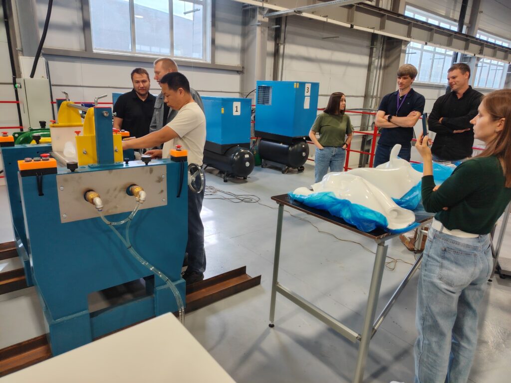 The customer's team observing silicone rubber material preparation at their facility.
