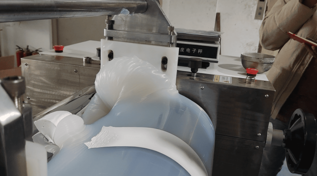 Diffuser agent being mixed into the silicone rubber compound inside a refining machine
