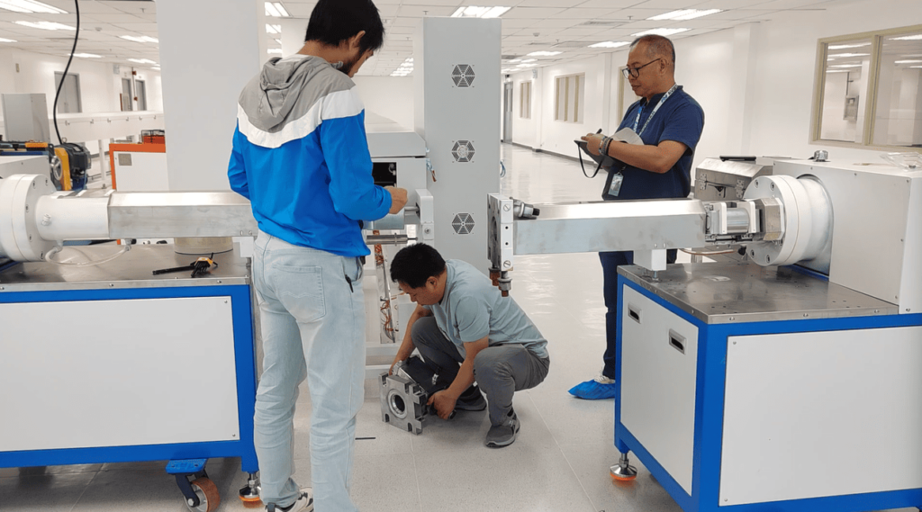 Customer's engineer taking notes during a workshop layout planning meeting for the extruder machine placement.