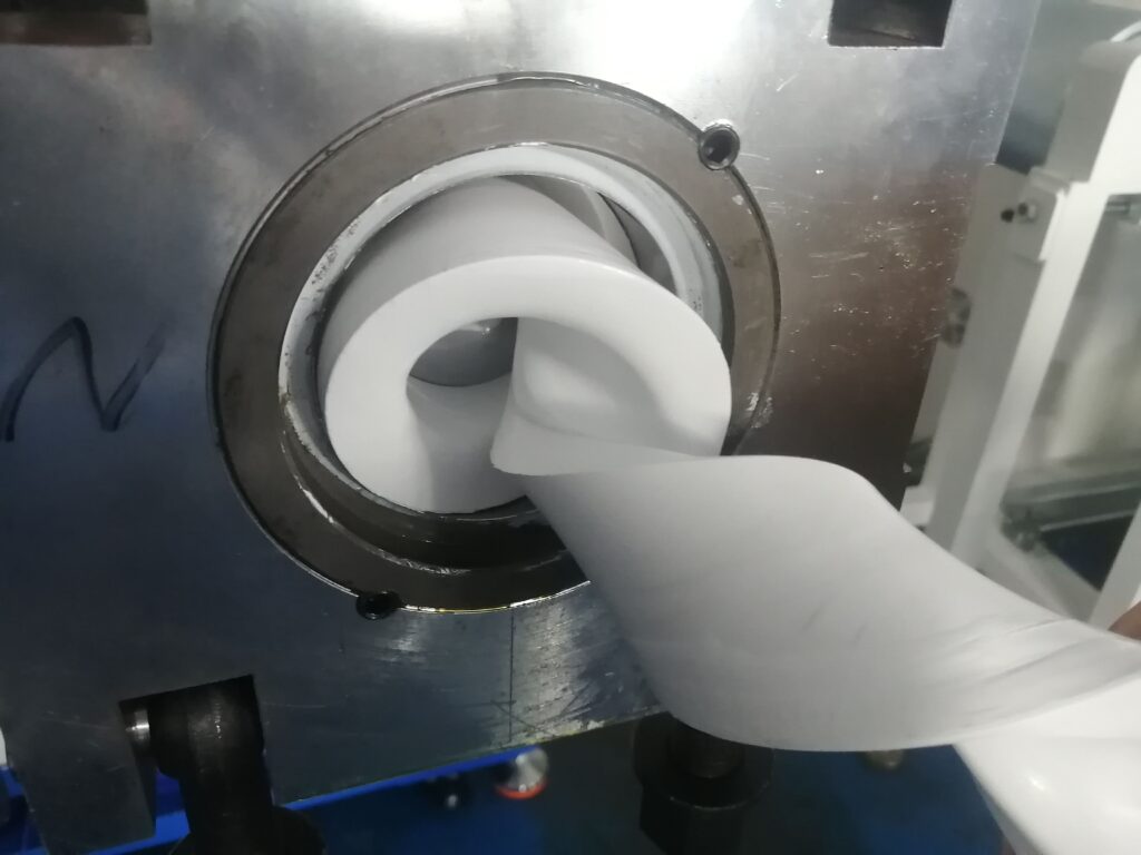 Purging material being extruded from the machine barrel to clean the screw and chamber.