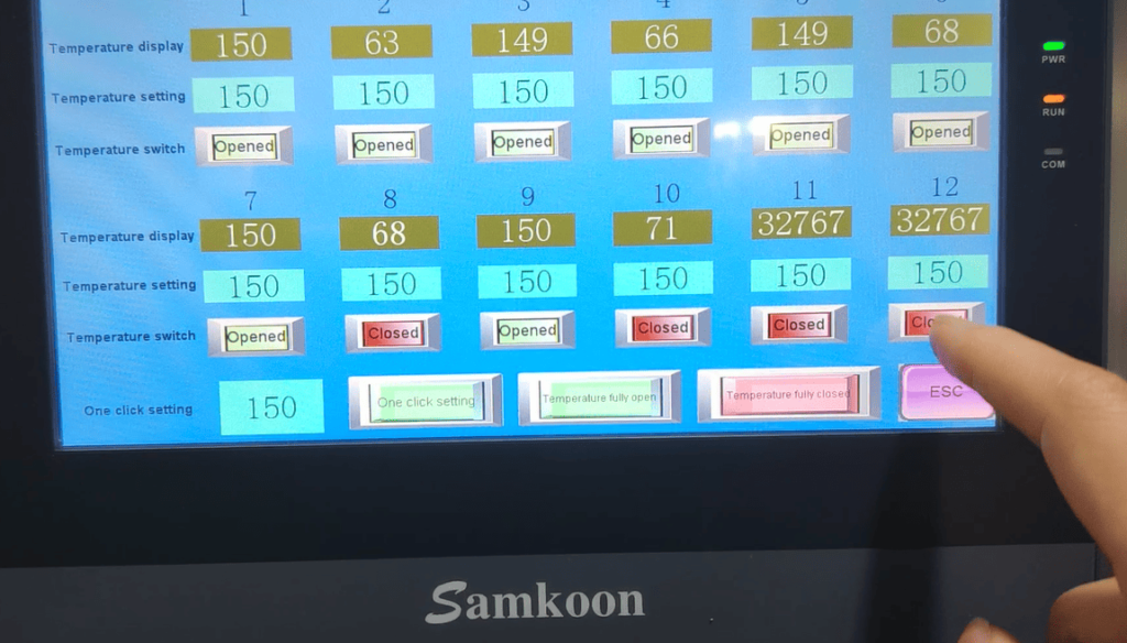 Close-up of the HMI interface showing one-click temperature zone control for the extrusion process.