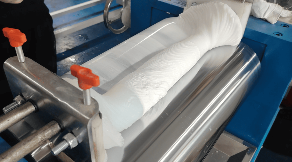 Technician adding platinum-based curing catalyst into the silicone rubber compound during refining.