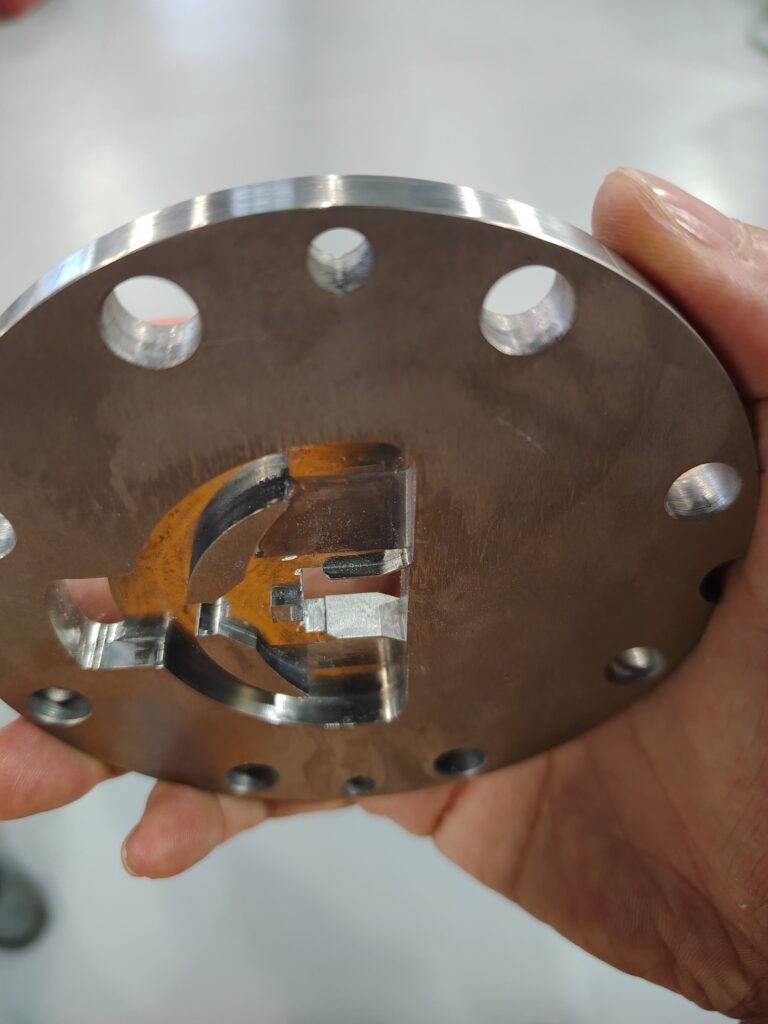 Close-up view of the intricate internal flow channels of a cleaned extrusion crosshead mold.