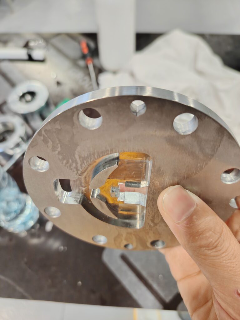 Close-up view of the intricate internal flow channels of a cleaned extrusion crosshead mold.