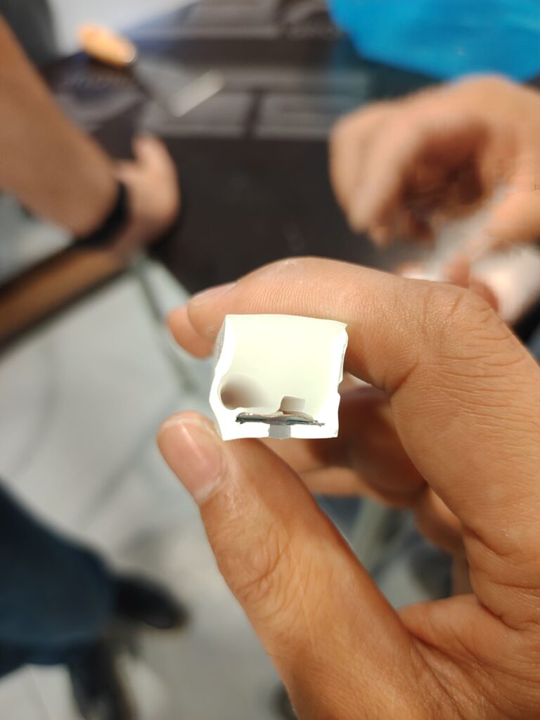 Cross-section view of a silicone LED strip revealing an air bubble trapped inside the encapsulation.