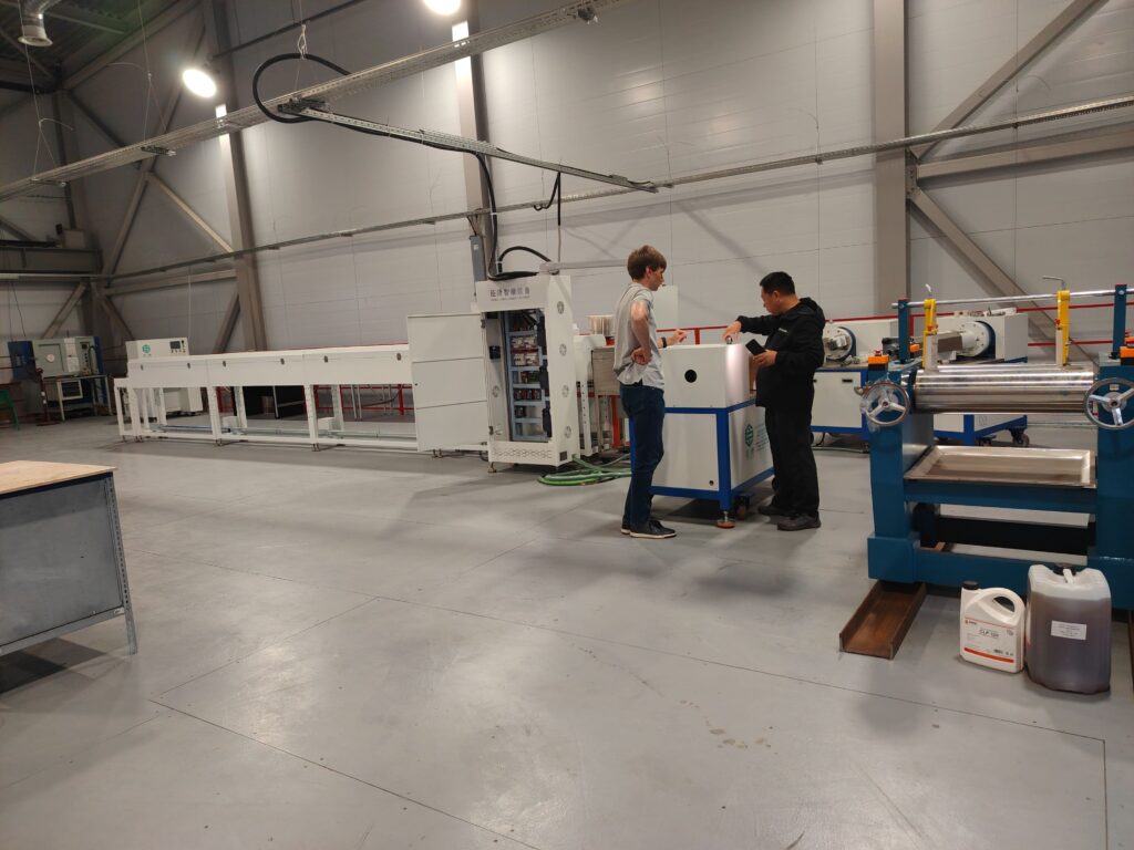 A compact, customized silicone LED strip extrusion production line installed and operating in a Russian factory.