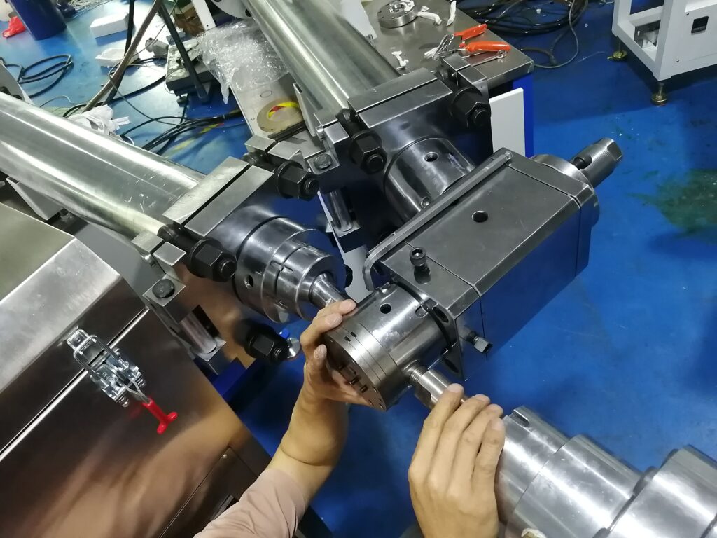Three extruder units connected to a single crosshead mold set for multi-layer or multi-color extrusion.