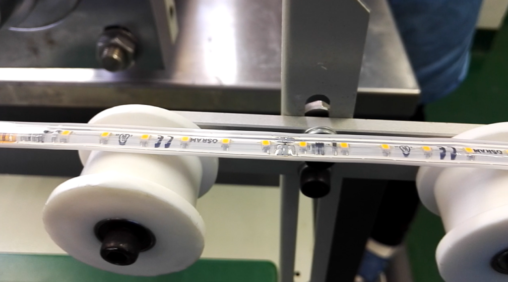A fresh extruded two-color silicon LED strip on the production line